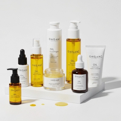 Close-up of various non-comedogenic skincare products on a clean, minimalist background