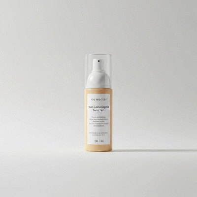 Bottle of non-comedogenic sunscreen on a clean background